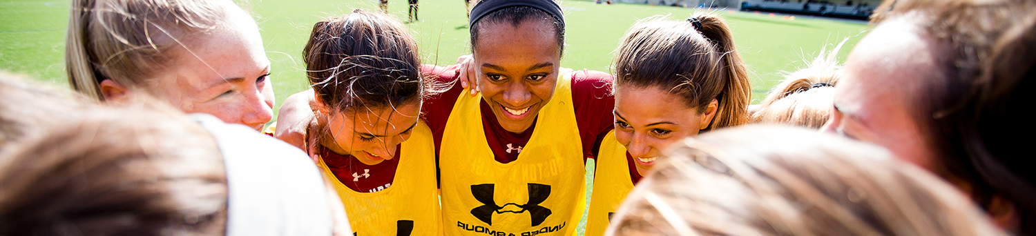 student athletes huddle