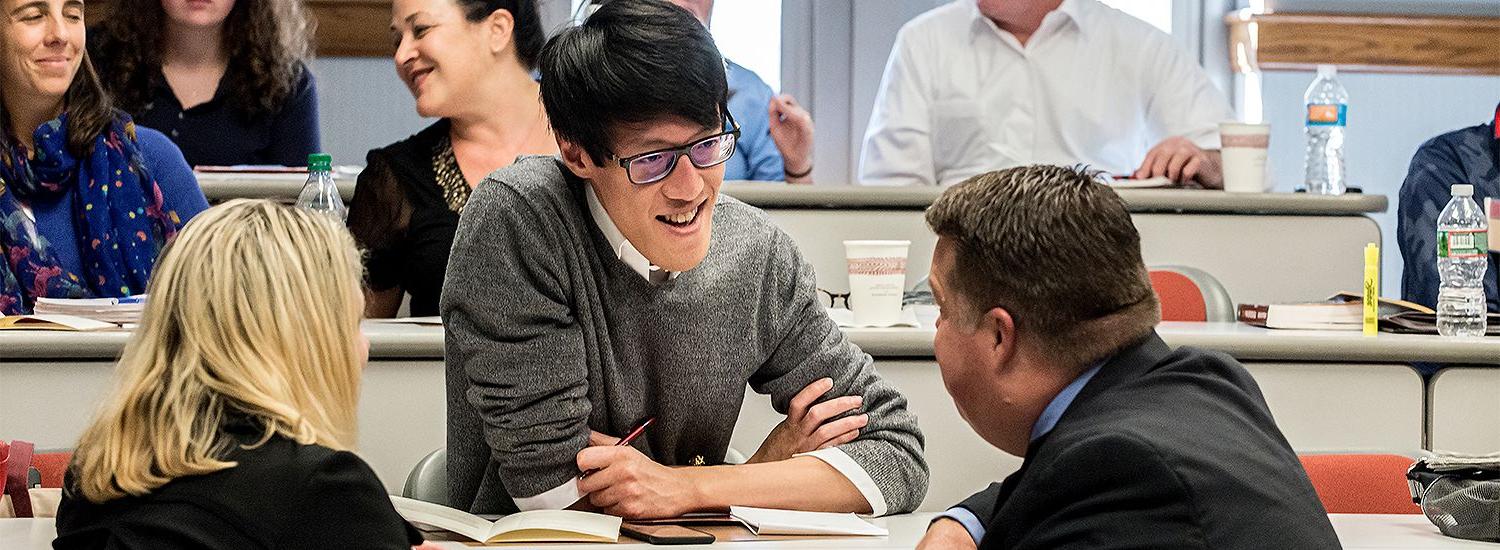 students talking in a classroom